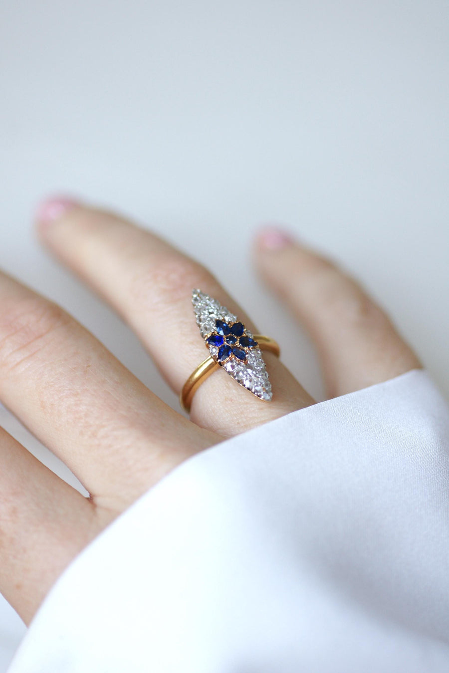 Antique Marquise Sapphire Star Ring Surrounded by Diamonds on Yellow Gold and Platinum