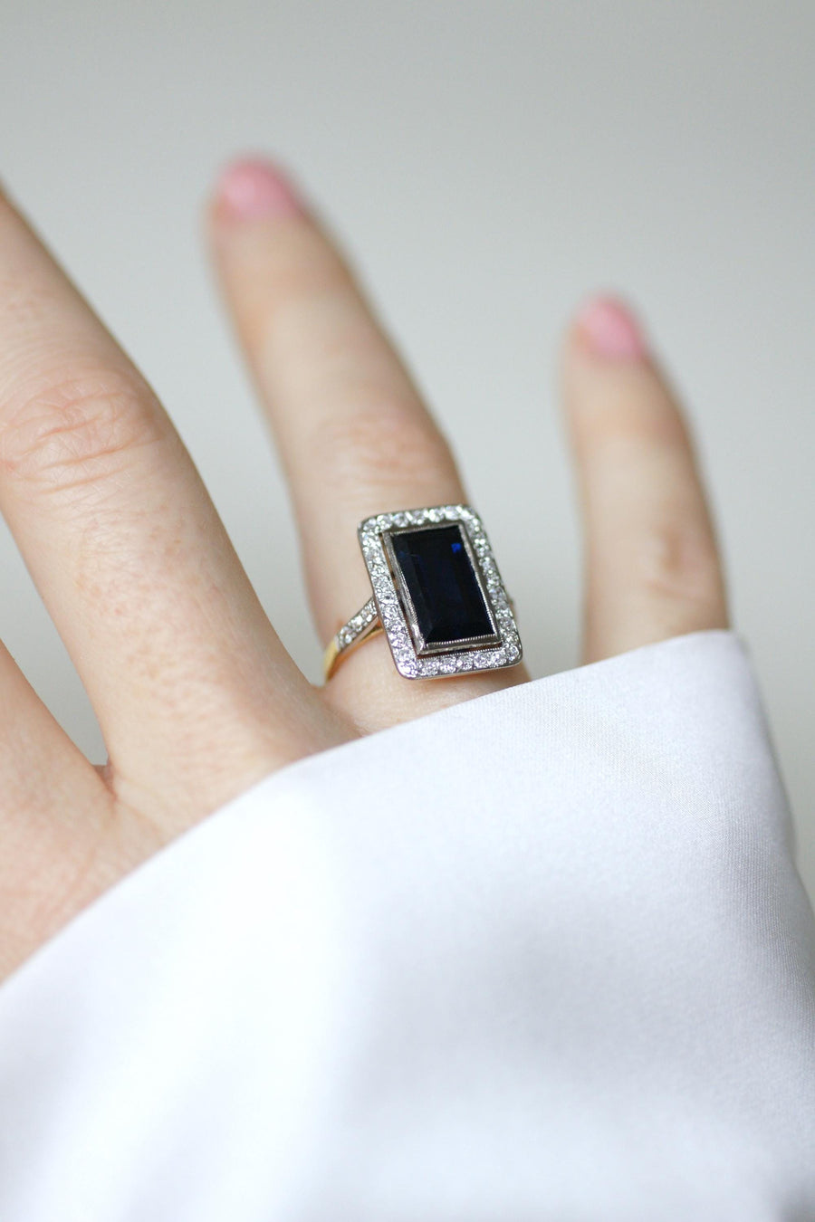 Art Deco Rectangle Ring Sapphire 4.40 Cts surrounded by Diamonds on Yellow Gold and Platinum