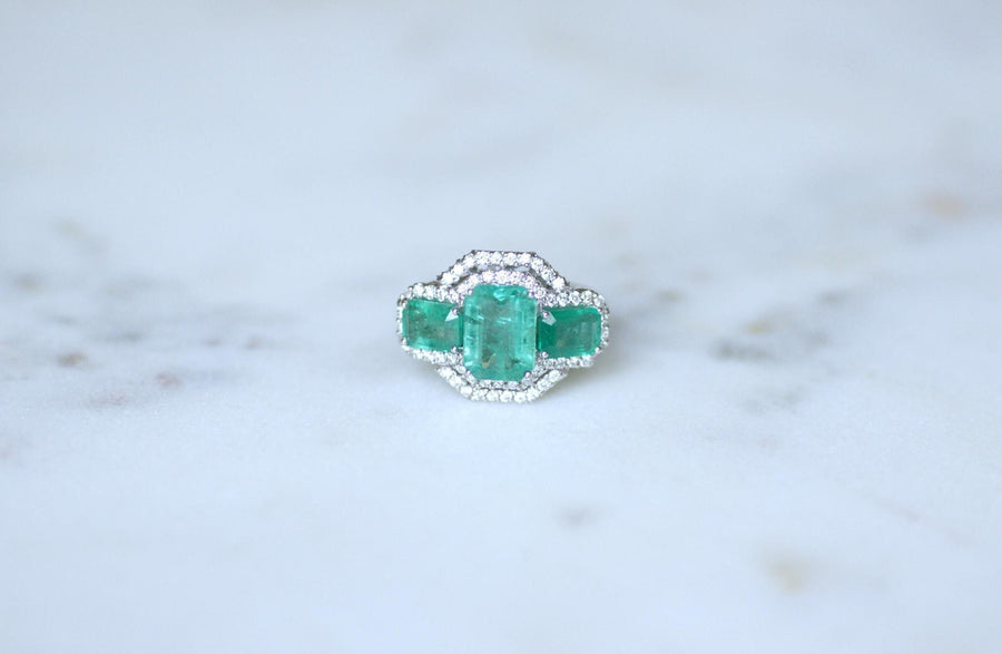 Ring Three Emeralds Surrounded by Diamonds on White Gold