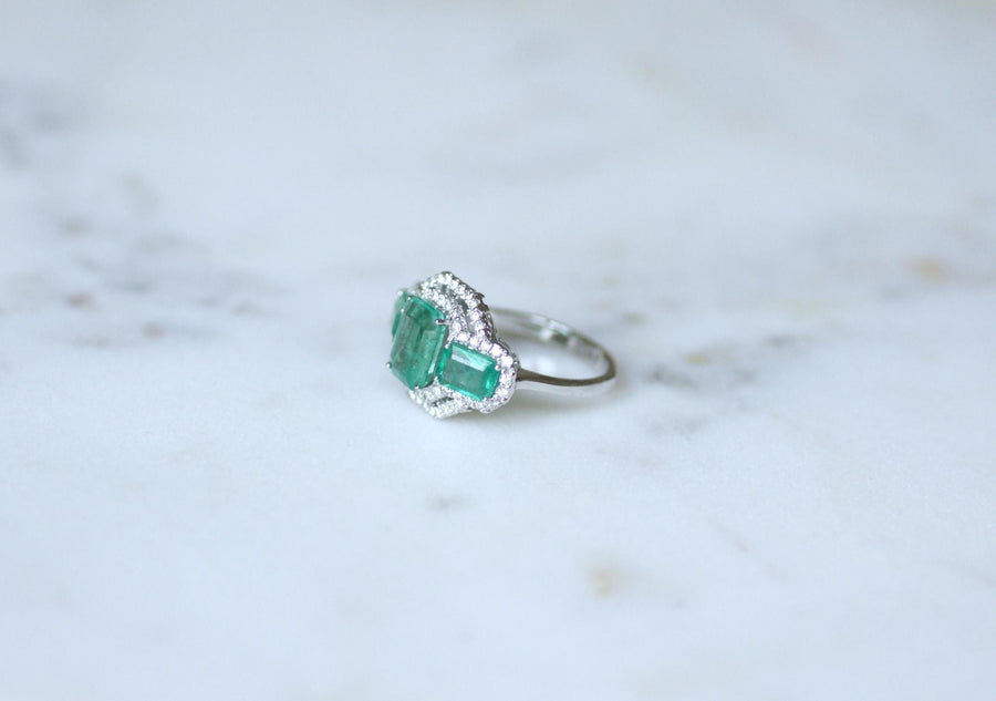 Ring Three Emeralds Surrounded by Diamonds on White Gold