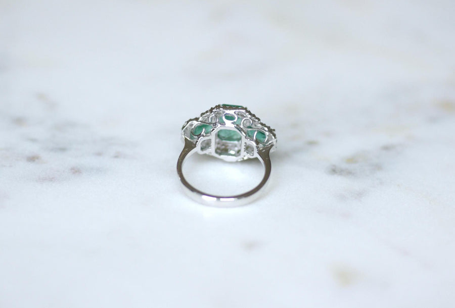 Ring Three Emeralds Surrounded by Diamonds on White Gold