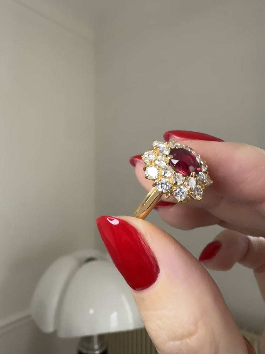 Ruby daisy ring set in diamonds