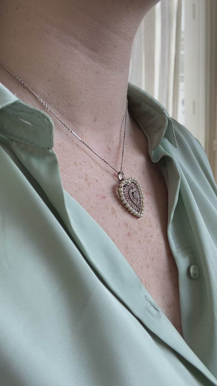 Diamond and pearl heart pendant in platinum