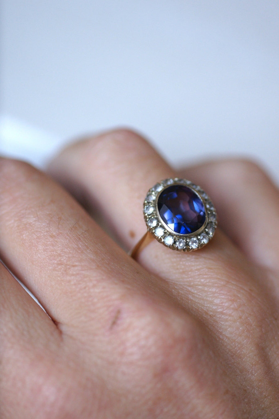 Synthetic sapphire daisy ring surrounded by white sapphires - Penelope Gallery