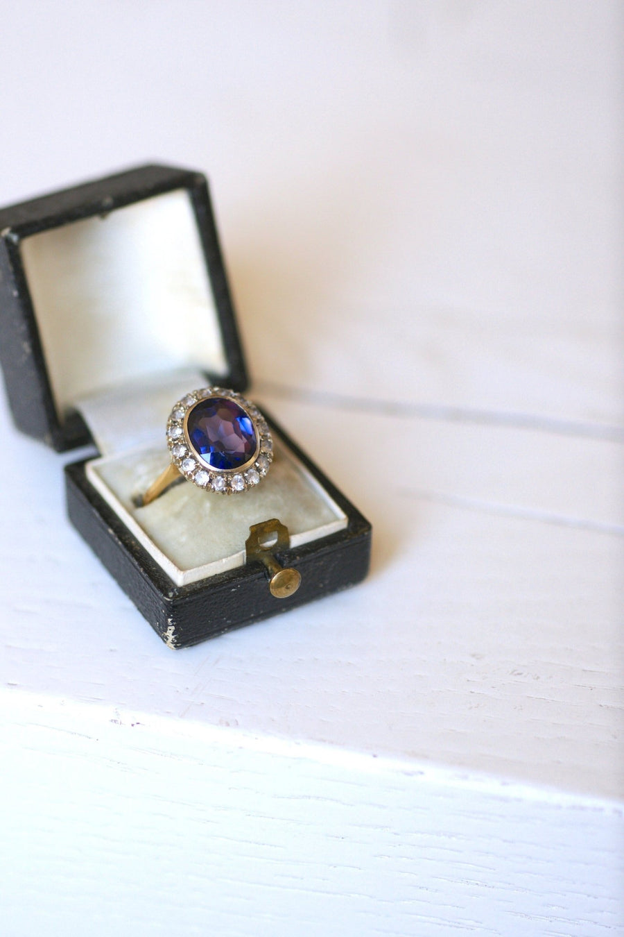 Synthetic sapphire daisy ring surrounded by white sapphires - Penelope Gallery