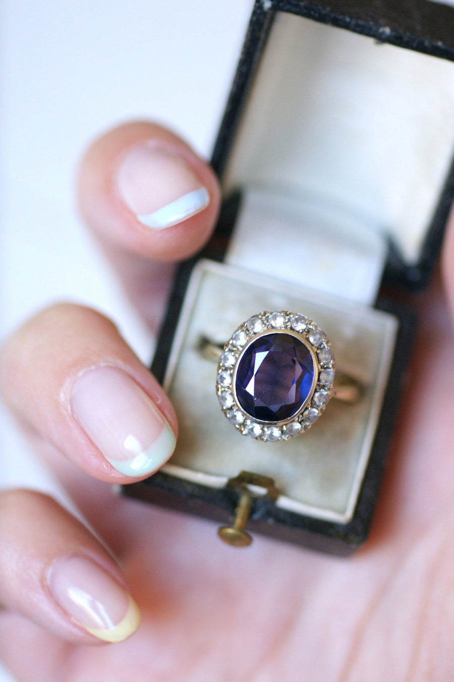 Synthetic sapphire daisy ring surrounded by white sapphires - Penelope Gallery