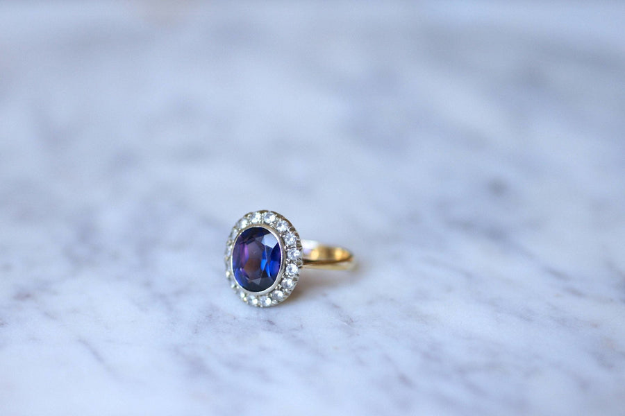 Synthetic sapphire daisy ring surrounded by white sapphires - Penelope Gallery