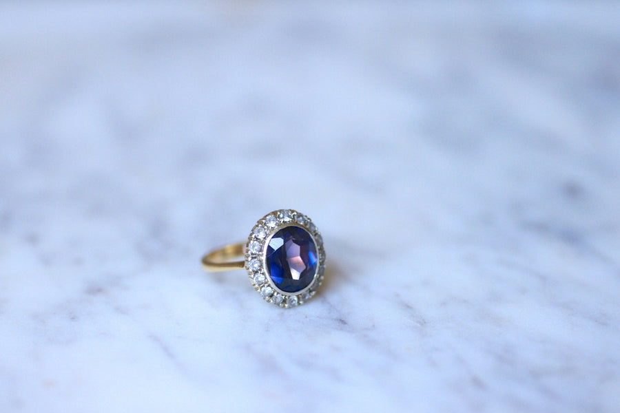 Synthetic sapphire daisy ring surrounded by white sapphires - Penelope Gallery