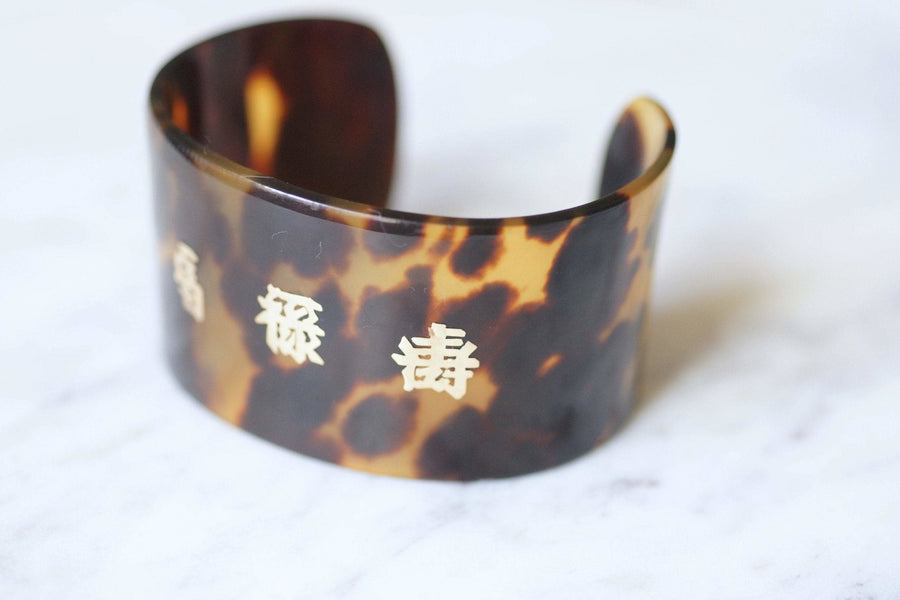Vintage tortoiseshell and gold ideograms cuff bracelet, 70's - Galerie Pénélope