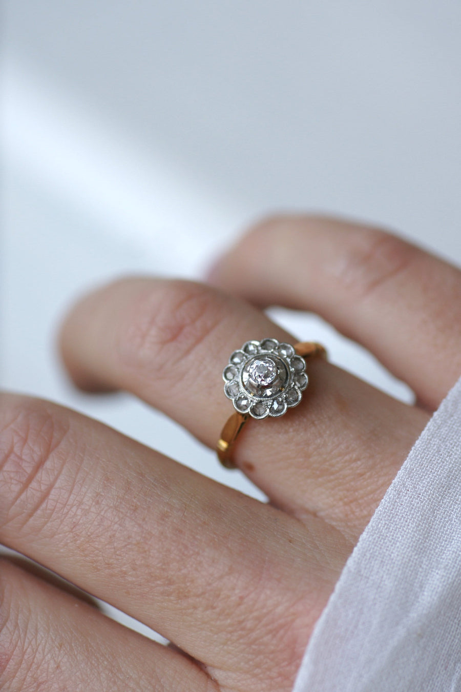 Gold, platinum and diamond daisy ring, early 20th century