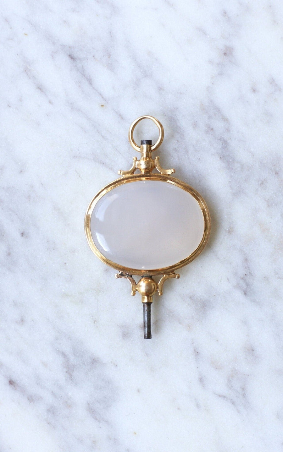 Chalcedony on gold watch key pendant - Galerie Pénélope