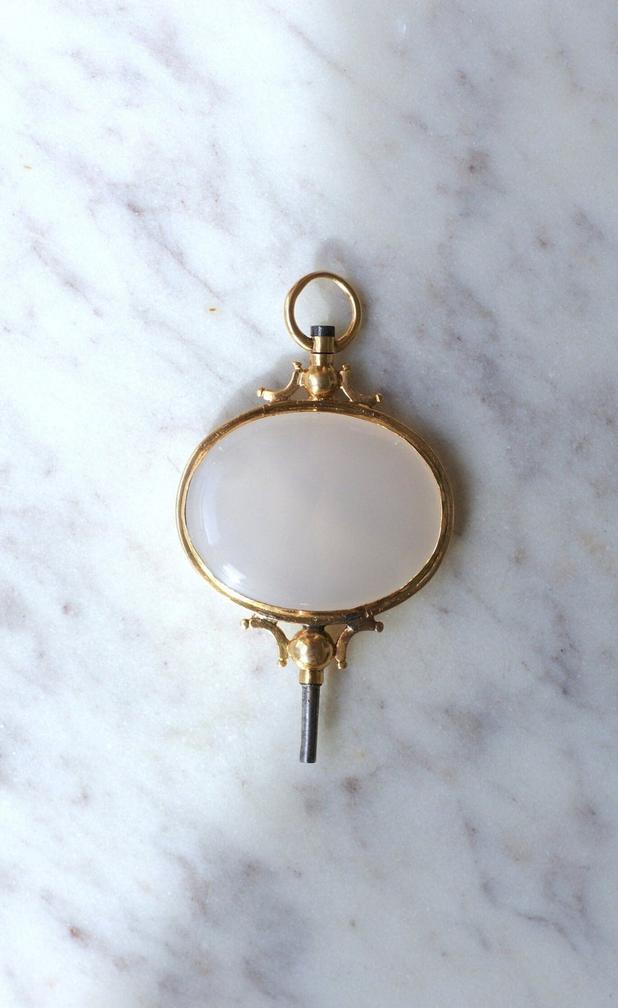 Chalcedony on gold watch key pendant - Galerie Pénélope