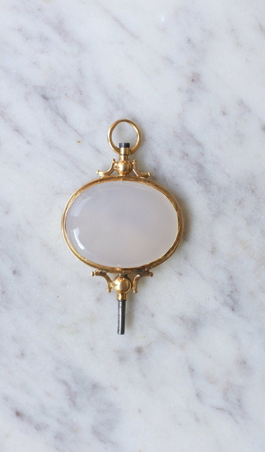 Chalcedony on gold watch key pendant - Galerie Pénélope