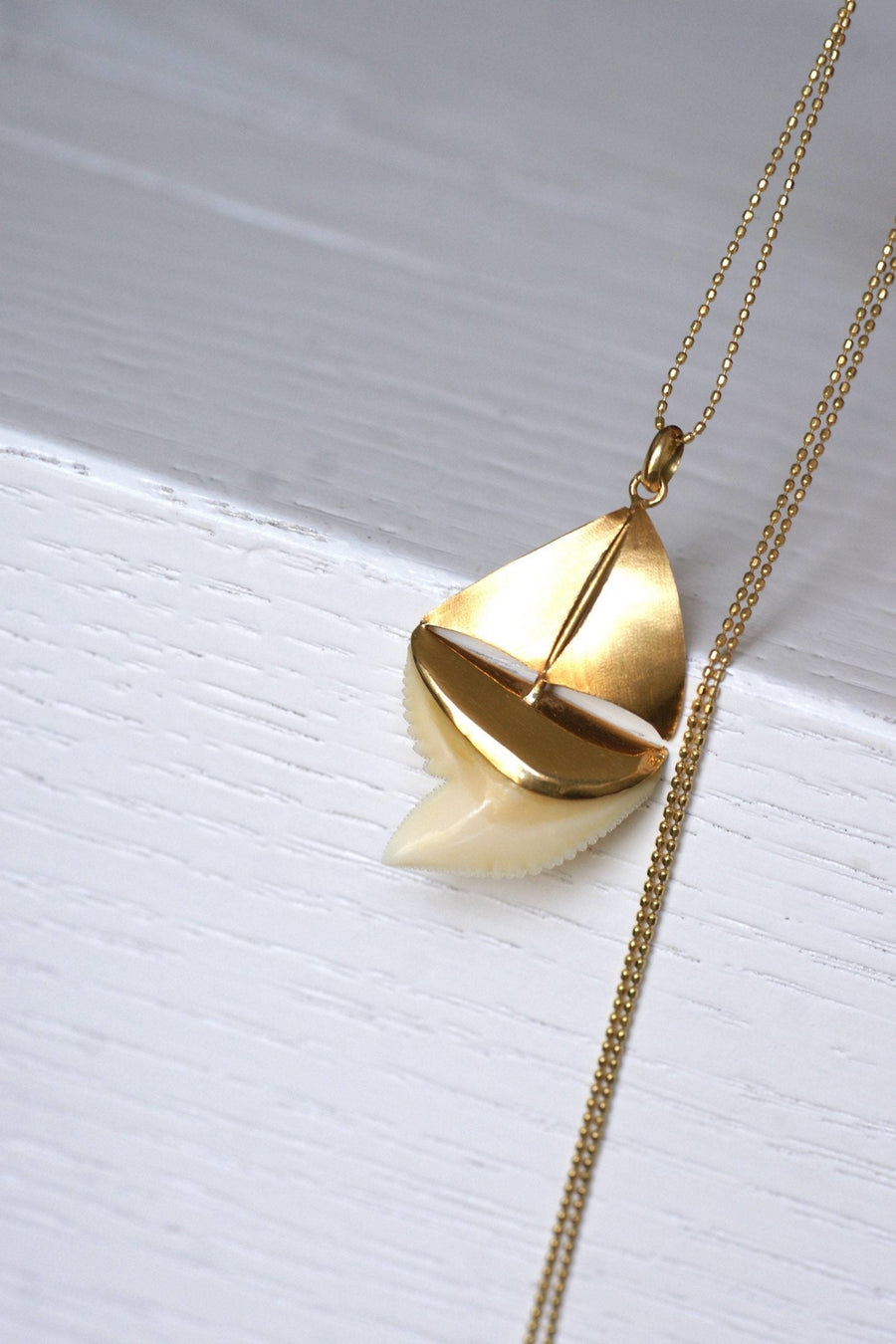 Shark tooth sailboat pendant on gold - Penelope Gallery
